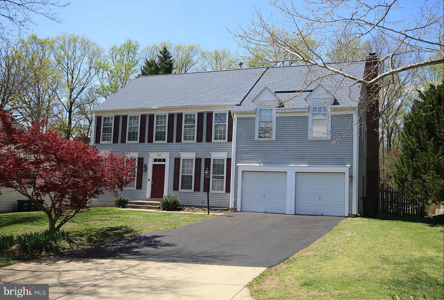 4708 Silverbrook Way Bowie, MD 20720 - Photo 1 of 21 a front view of a house with a yard and garage