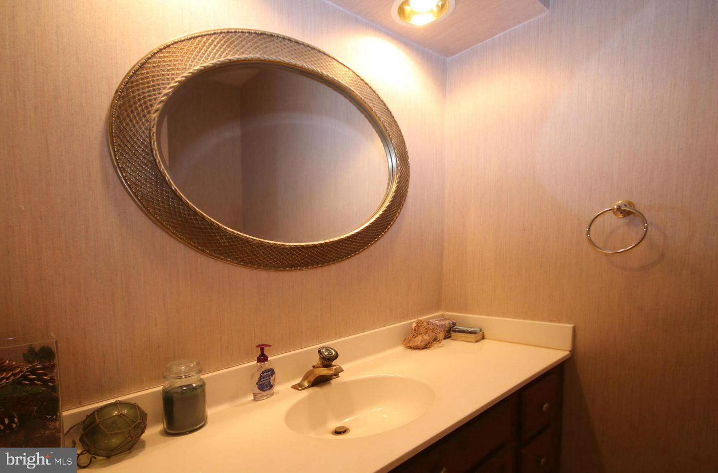 4708 Silverbrook Way Bowie, MD 20720 - Photo 17 of 21 a bathroom with a sink and a mirror