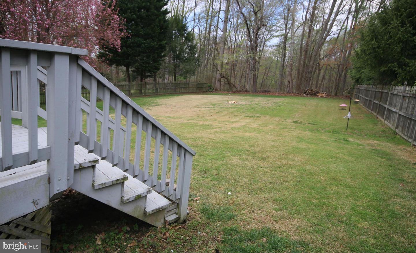 4708 Silverbrook Way Bowie, MD 20720 - Photo 19 of 21 a view of balcony with wooden floor and trees