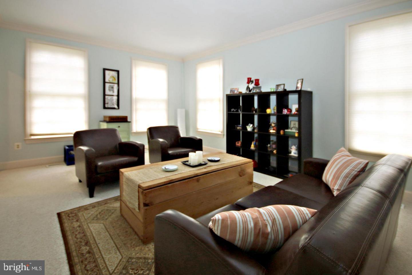 4708 Silverbrook Way Bowie, MD 20720 - Photo 2 of 21 a living room with furniture a window and a large window