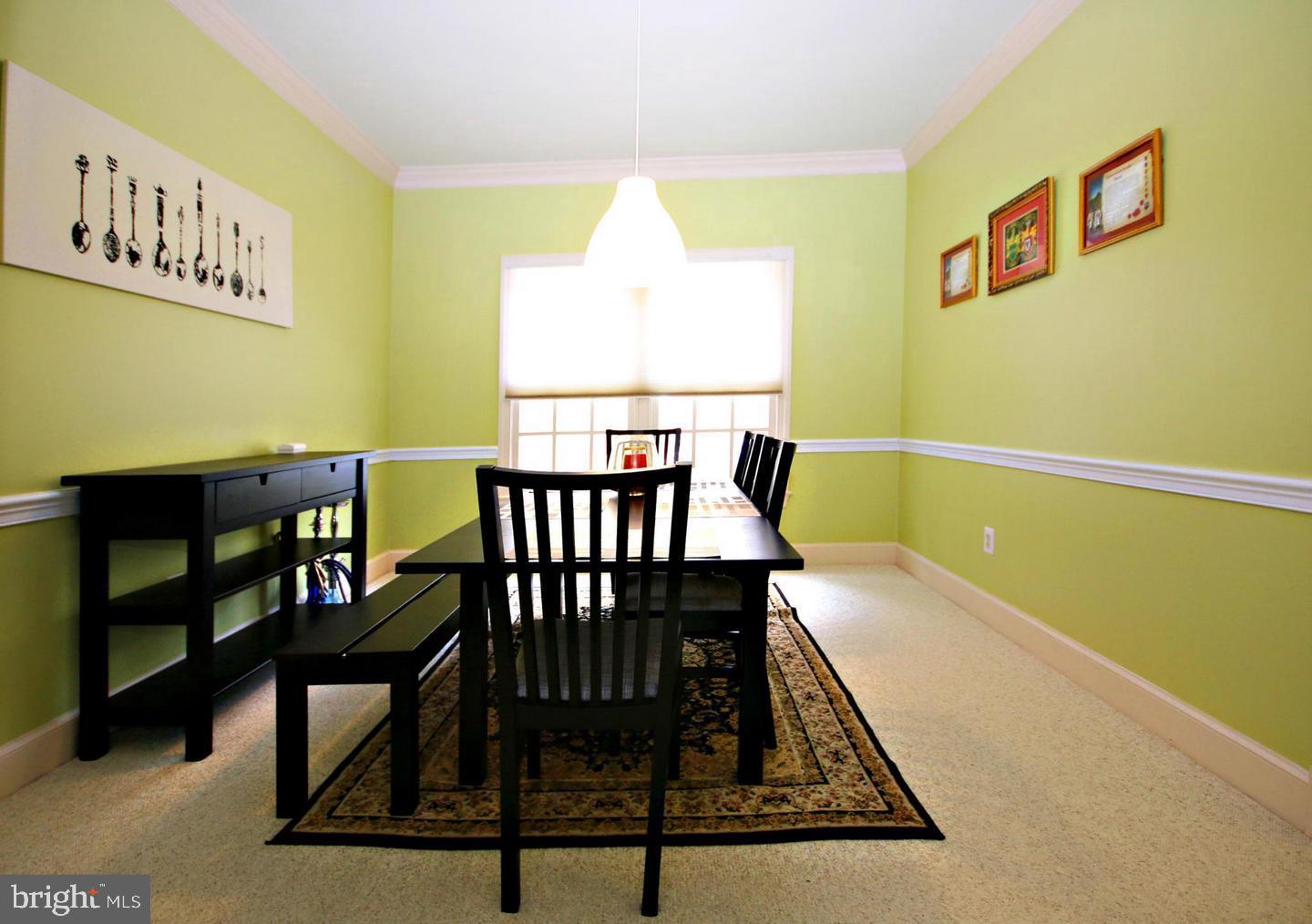 4708 Silverbrook Way Bowie, MD 20720 - Photo 6 of 21 a view of a dining room with furniture and a window