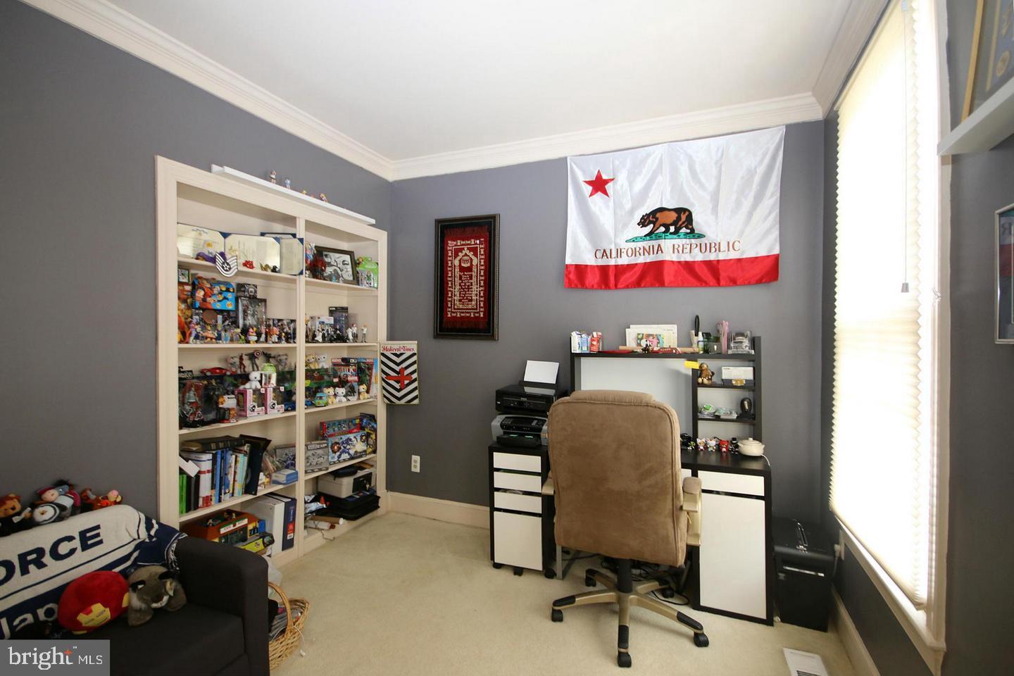 4708 Silverbrook Way Bowie, MD 20720 - Photo 8 of 21 a view of a workspace with furniture and toys