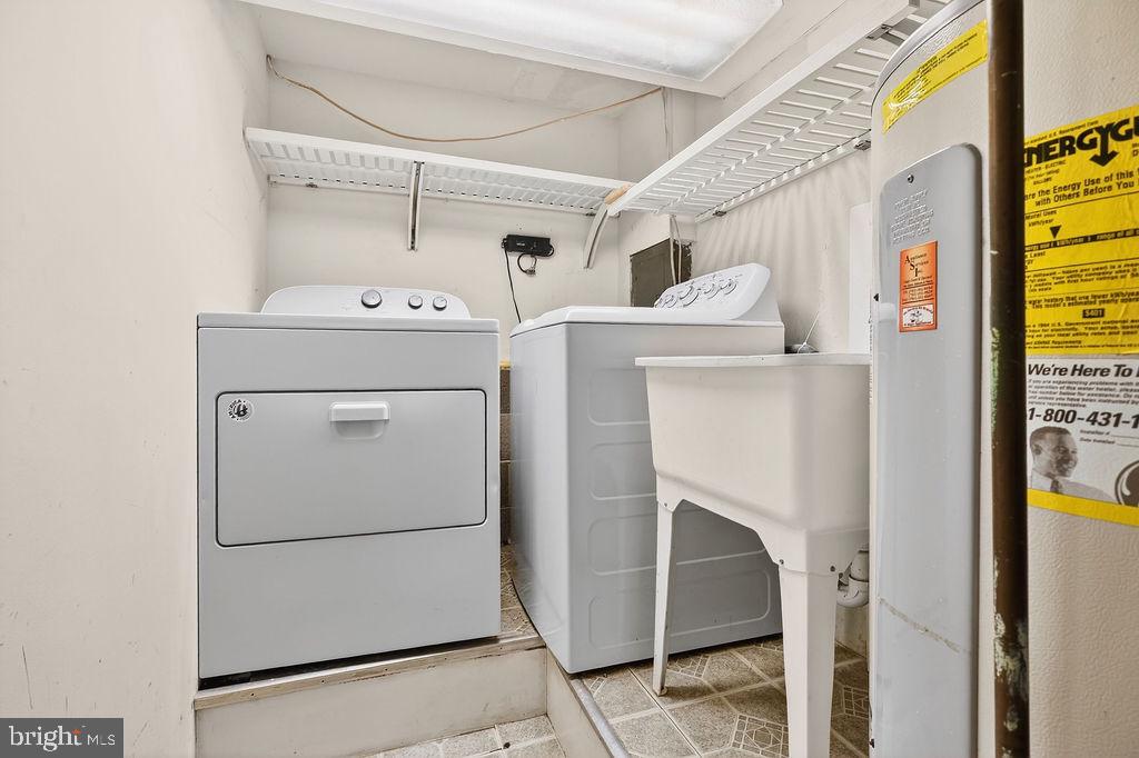 8471 Great Lake Lane Springfield, VA 22153 - Photo 37 of 65 a utility room with dryer and washer