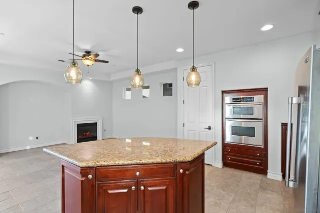 a kitchen with a table and chairs