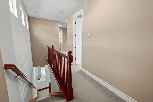 a view of a hallway with staircase