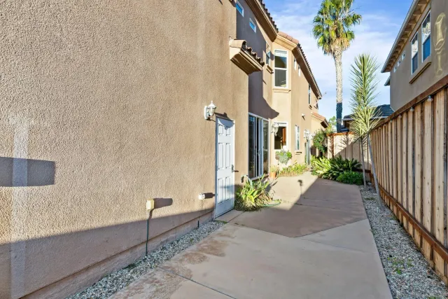 a view of a street with potted plants