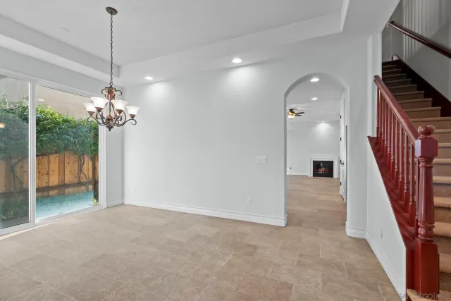 a view of a hallway with a chandelier