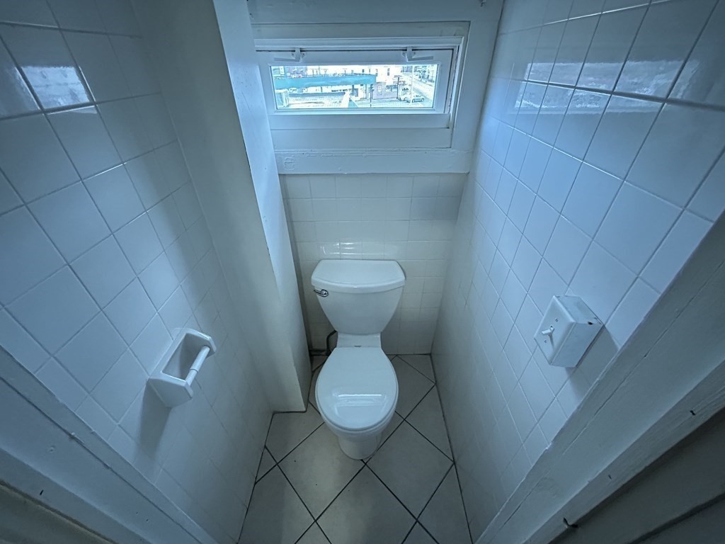 694 Lakeview Avenue, Unit 3 Lowell, MA 01850 - Photo 11 of 19 a bathroom with a toilet