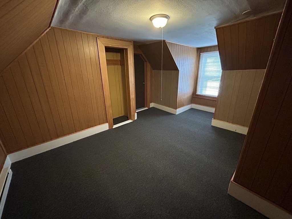 694 Lakeview Avenue, Unit 3 Lowell, MA 01850 - Photo 15 of 19 an empty room with windows