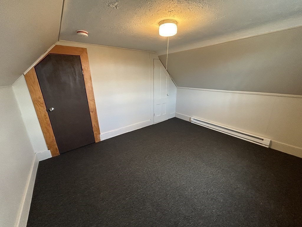 694 Lakeview Avenue, Unit 3 Lowell, MA 01850 - Photo 16 of 19 an empty room with a door