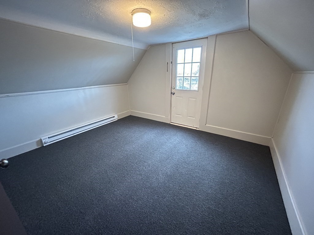694 Lakeview Avenue, Unit 3 Lowell, MA 01850 - Photo 17 of 19 an empty room with a window