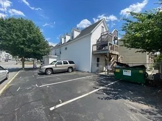 a view of a car park in front of house