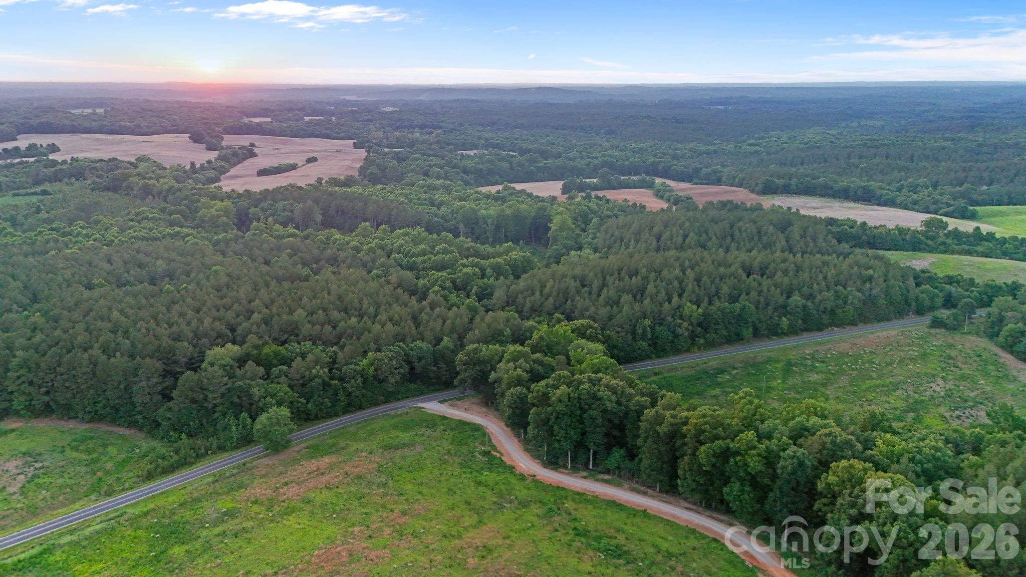 0 Lucy Short Cut Road, Unit 2 Marshville, NC 28103 - Photo 15 of 38 an aerial view of residential houses with outdoor space and trees