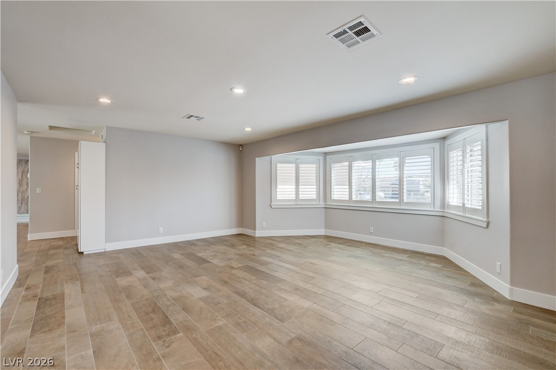 4207 Ridgecrest Drive Las Vegas, NV 89121 - Photo 11 of 27 Living room in front of home with so much space and great window lighting too!