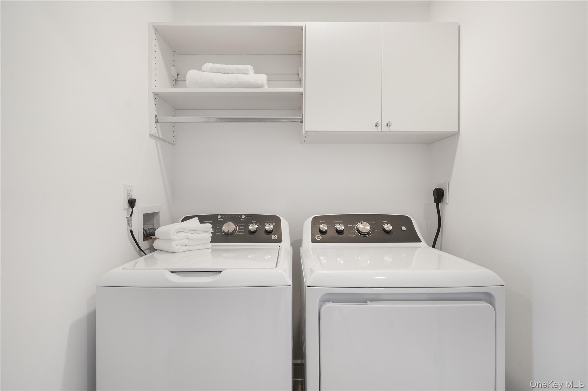 2040 Crompond Road, Unit 22 Yorktown Heights, NY 10598 - Photo 17 of 19 Laundry room featuring cabinets and washing machine and clothes dryer