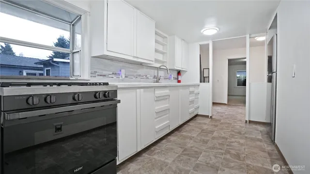 a view of a room with a wooden door