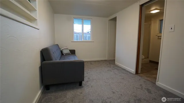 a view of a hallway with washer and dryer