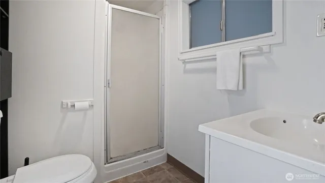 a view of an empty room with windows