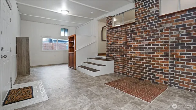 a view of a house with a backyard and deck