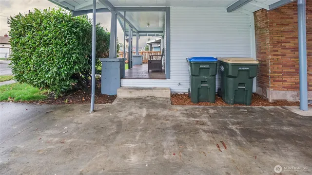 a view of a house with potted plants