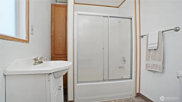 a kitchen with sink a refrigerator and washer