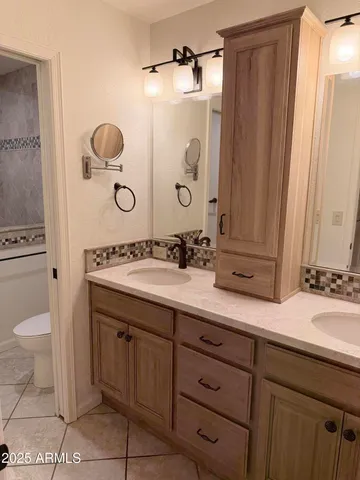 a view of a garden with lawn chairs