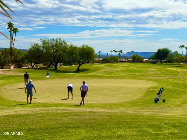 a view of a backyard with sitting area