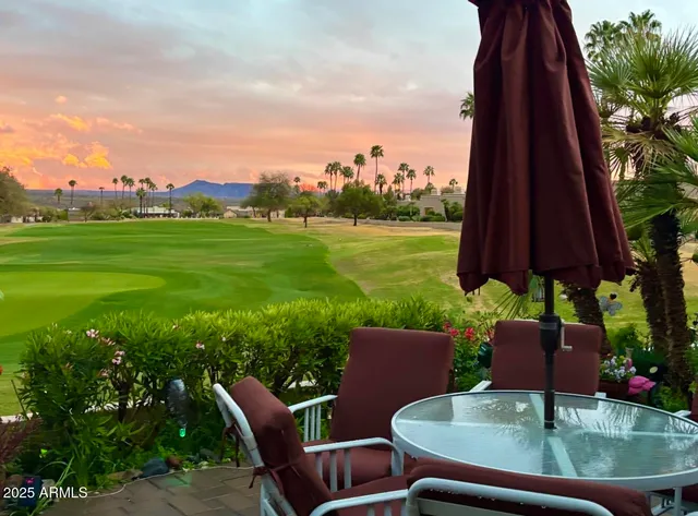 a view of a building and front view of a lake
