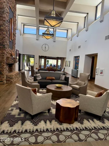 a view of a patio with a dining table and chairs under an umbrella