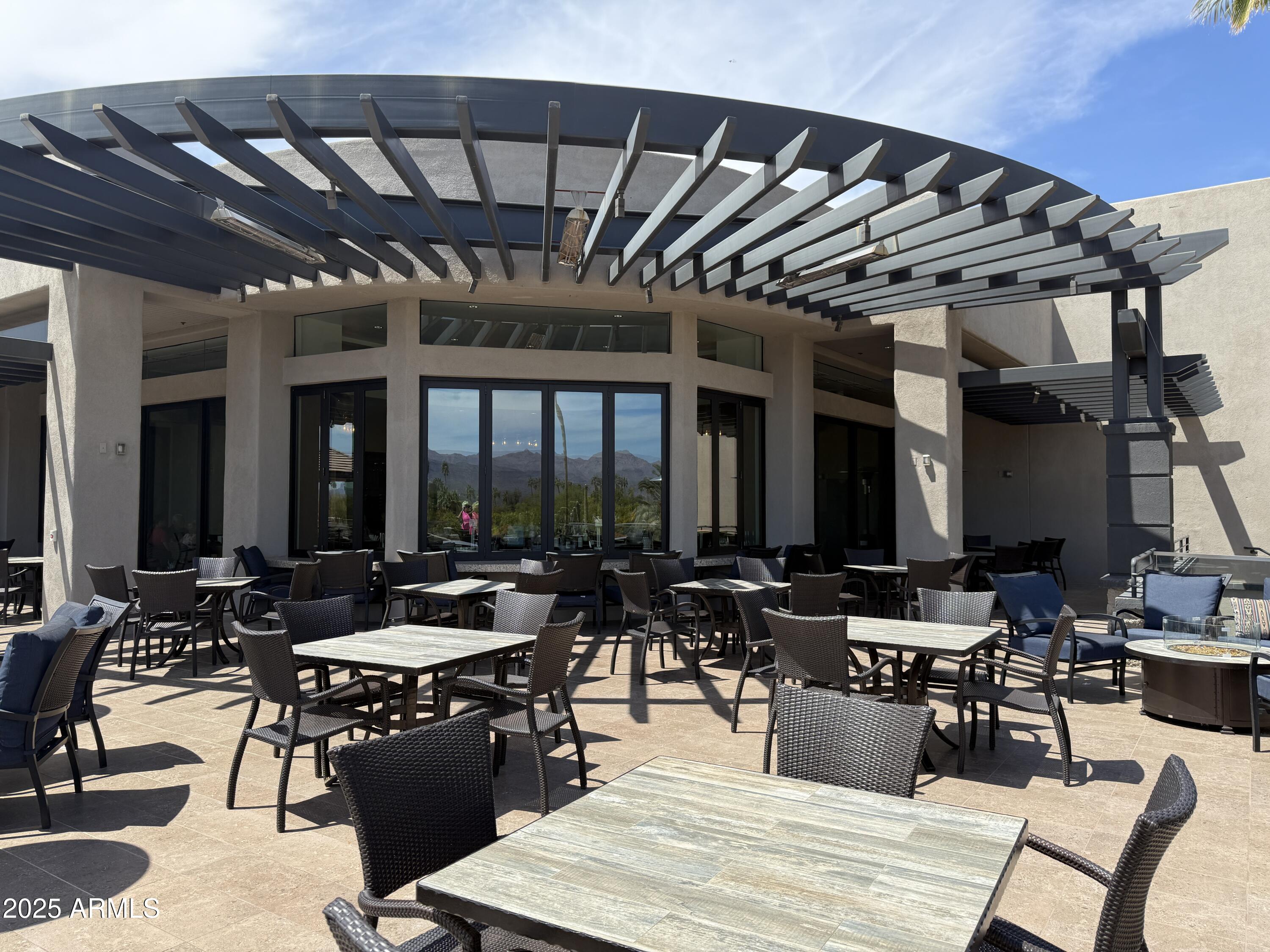 25615 North Bolero Bend, Unit 5 Rio Verde, AZ 85263 - Photo 32 of 65 a outdoor space with patio lots of furniture and white walls