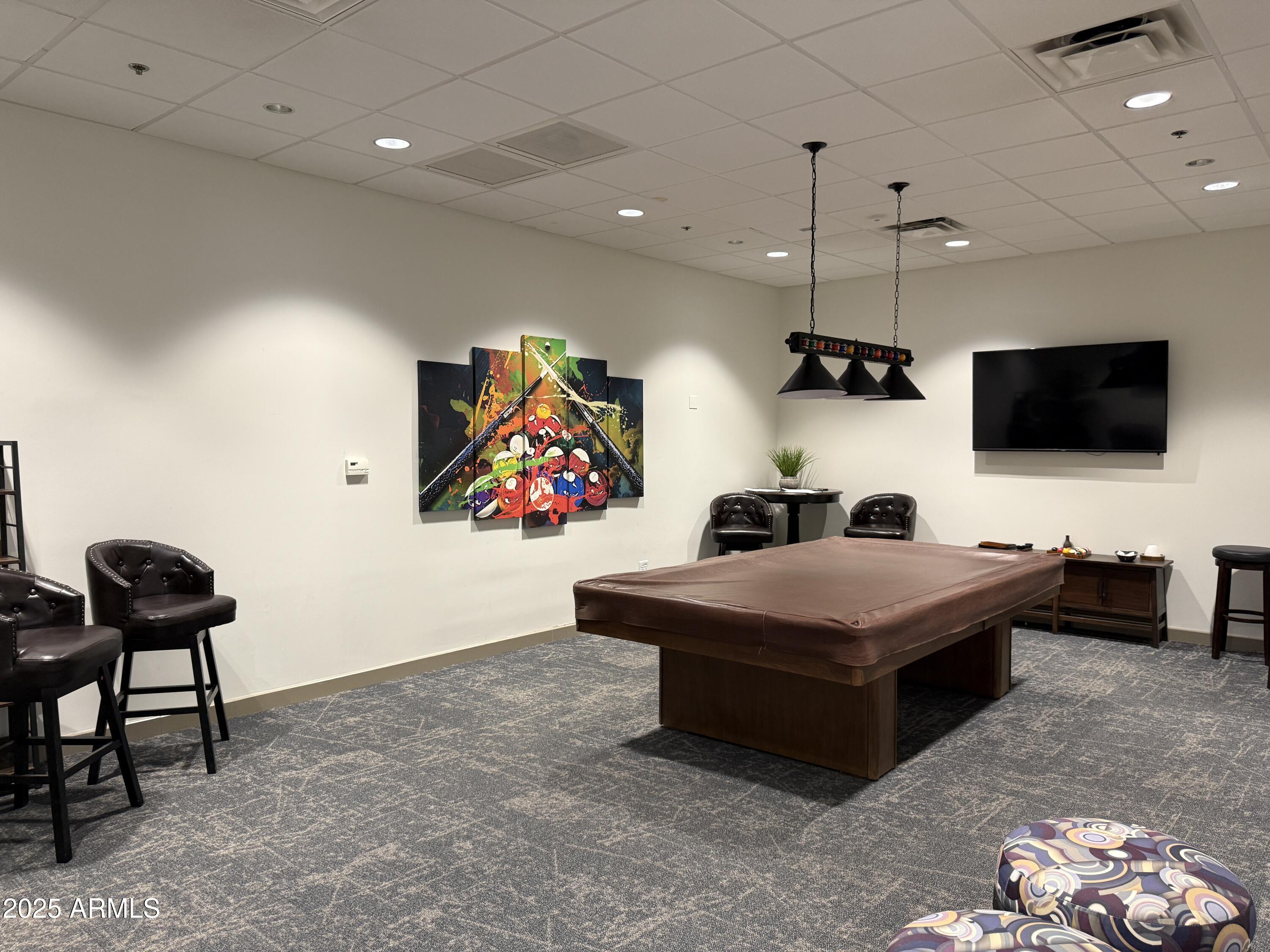 25615 North Bolero Bend, Unit 5 Rio Verde, AZ 85263 - Photo 46 of 65 a living room with furniture and a flat screen tv