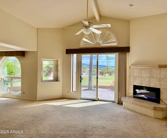a utility room with dryer and cabinets