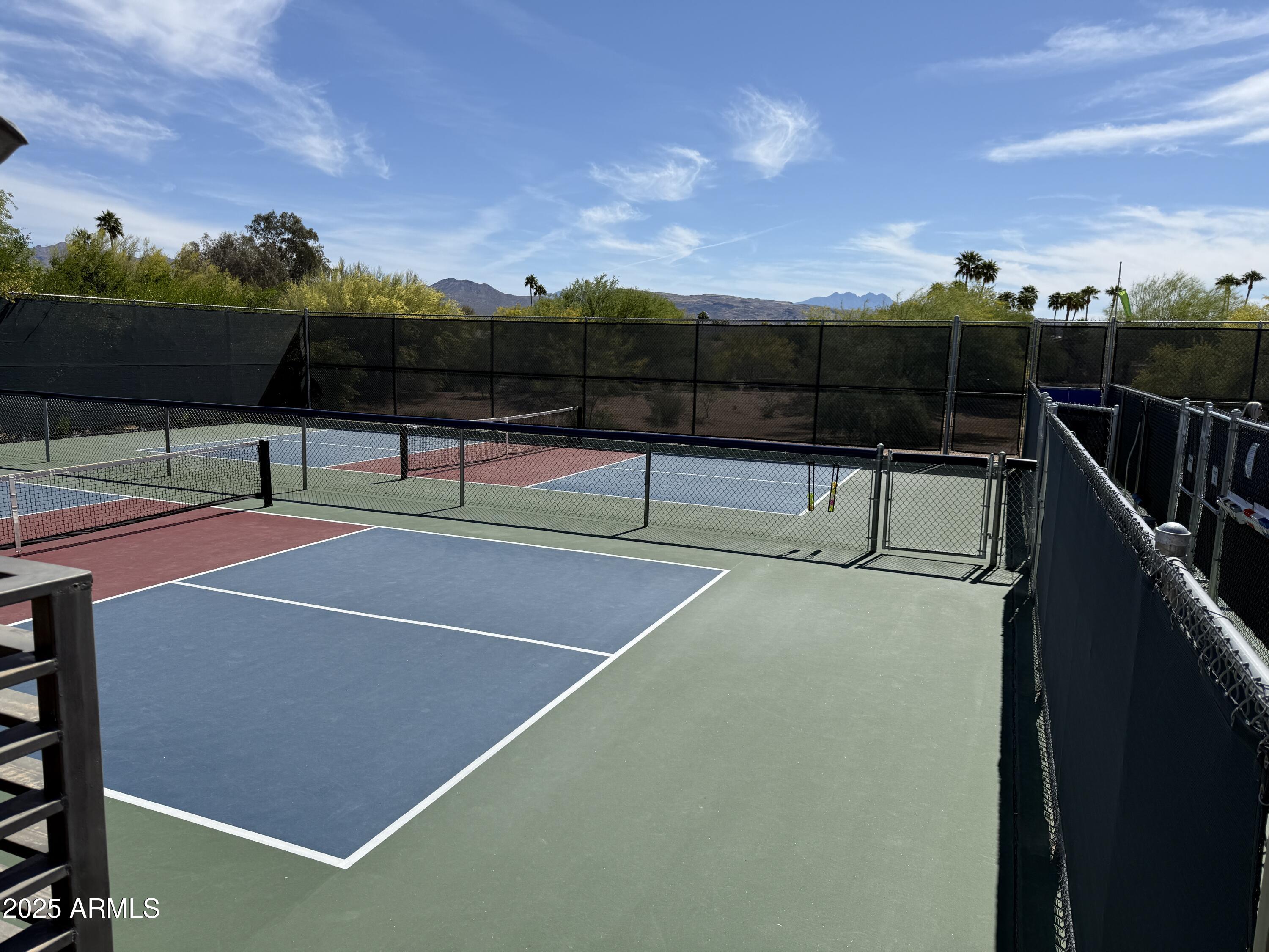 25615 North Bolero Bend, Unit 5 Rio Verde, AZ 85263 - Photo 60 of 65 a view of a tennis court with lots of swings and slides