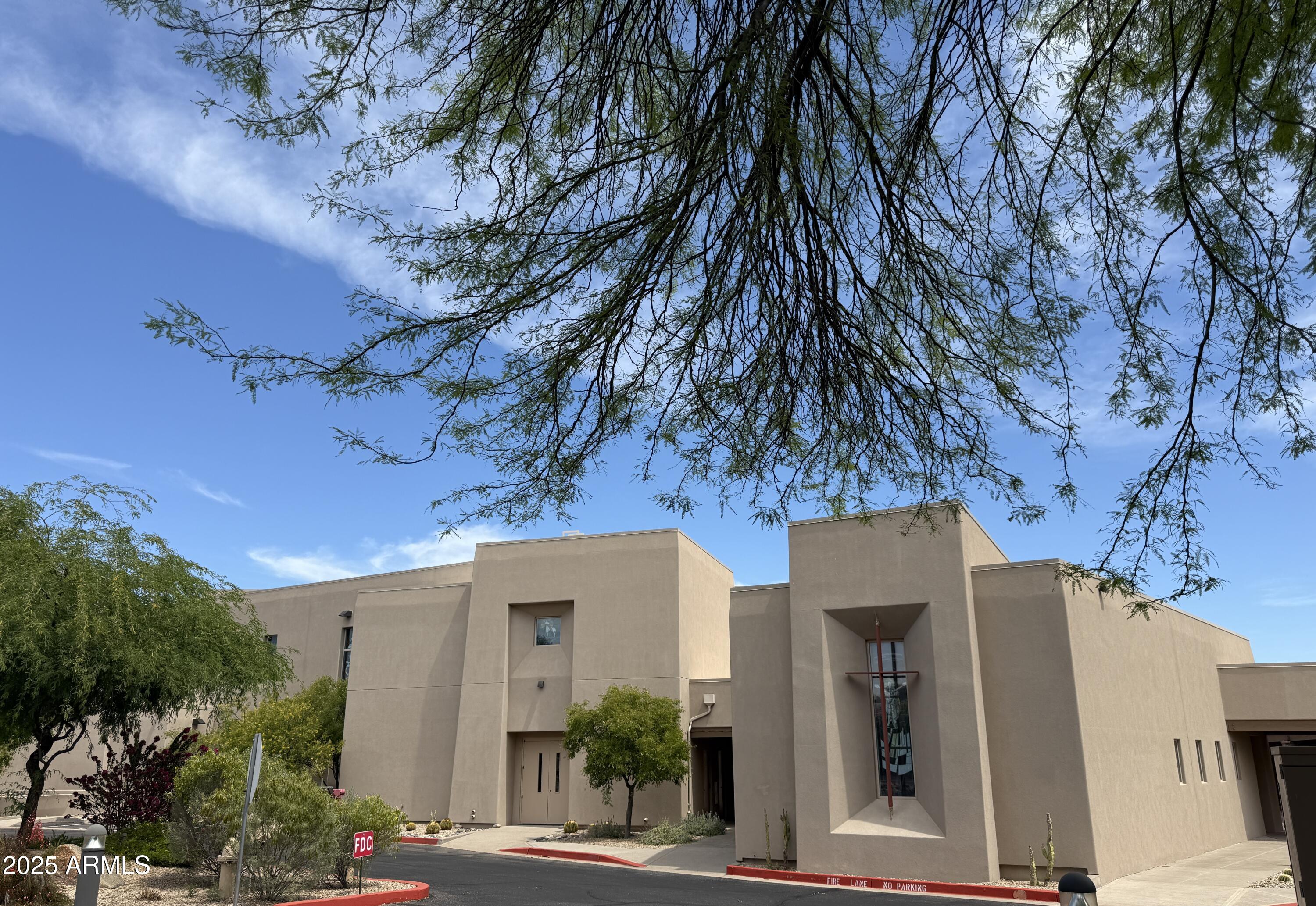 25615 North Bolero Bend, Unit 5 Rio Verde, AZ 85263 - Photo 65 of 65 a front view of a house with a tree