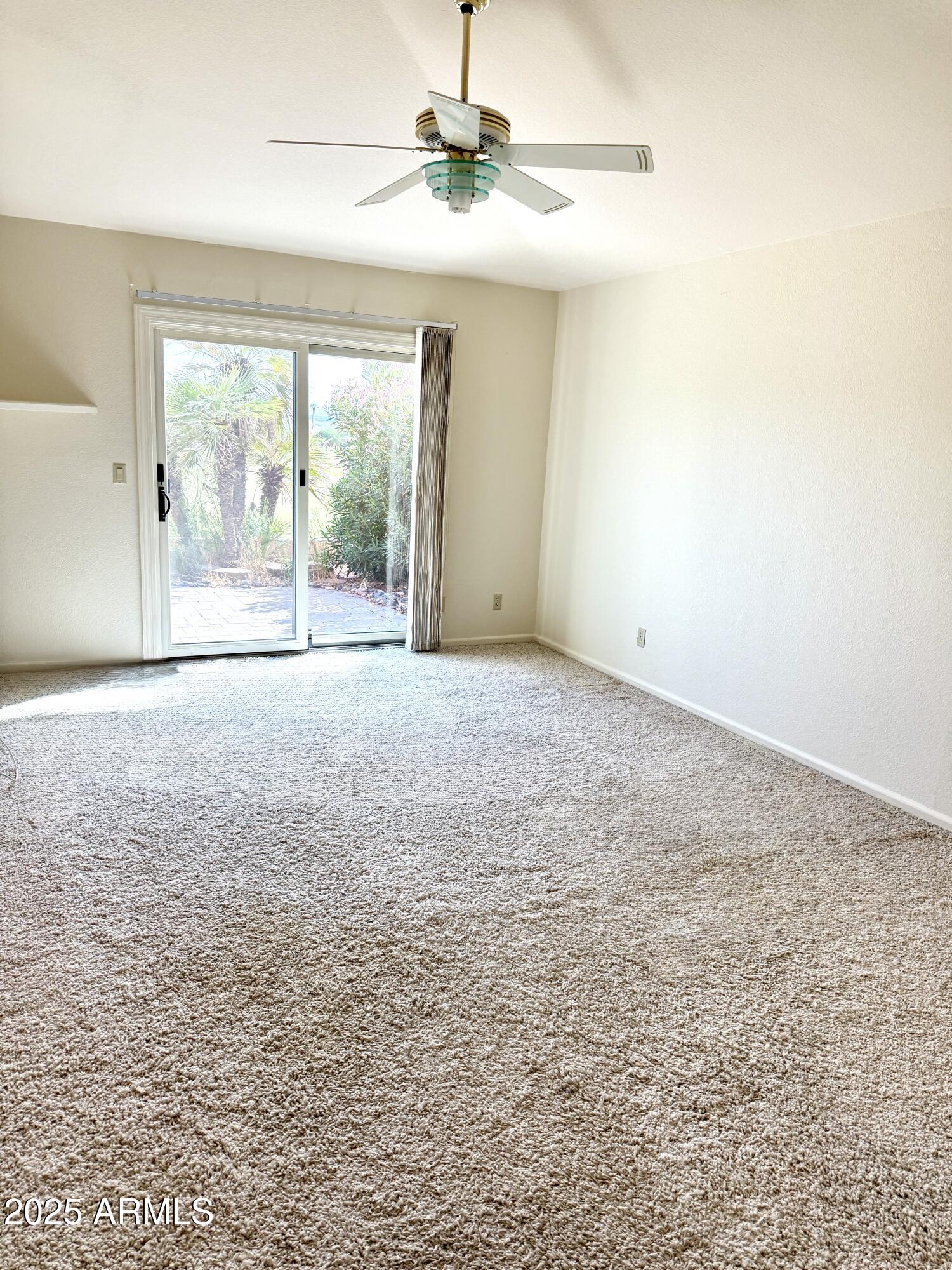 25615 North Bolero Bend, Unit 5 Rio Verde, AZ 85263 - Photo 7 of 65 a view of an empty room with a window