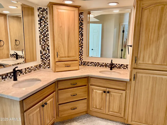 a bathroom with a granite countertop sink