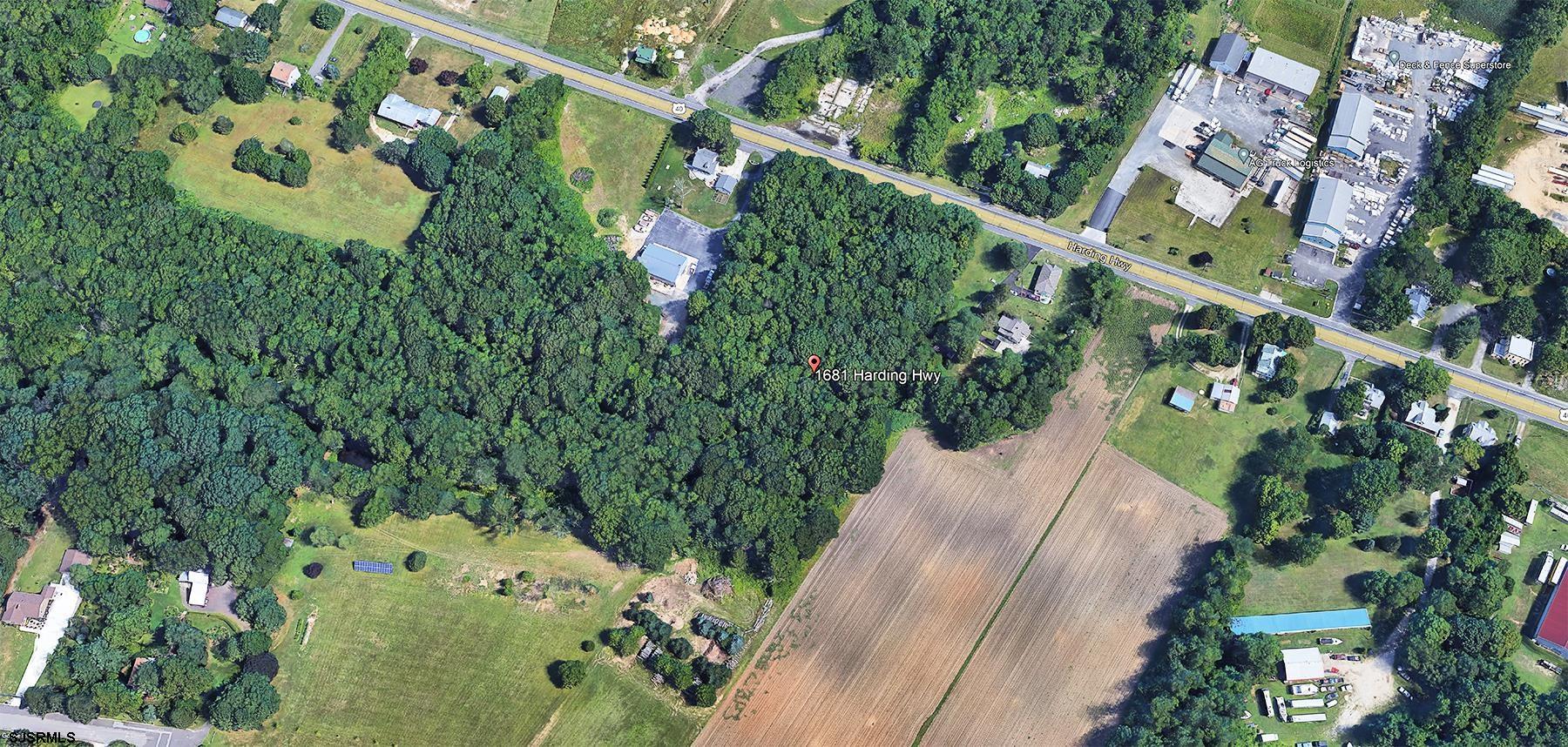 an aerial view of a house with a yard and garden