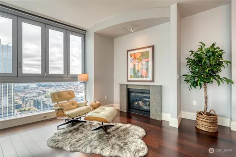 a kitchen with a stove cabinets and wooden floor