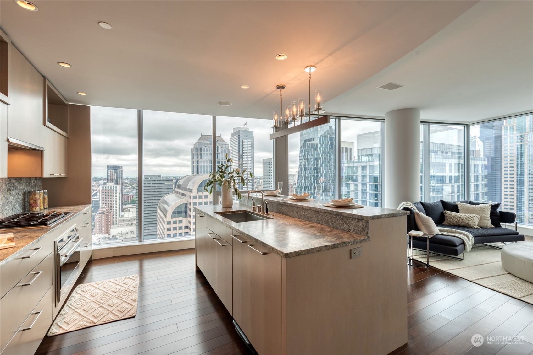 1521 2nd Avenue, Unit 3601 Seattle, WA 98101 - Photo 16 of 39 a living room with stainless steel appliances granite countertop a sink a couch and a large window