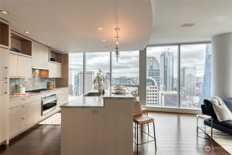 a dining room with table and chairs