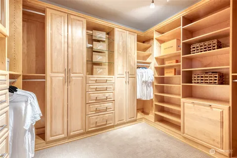 a work room with furniture and a wooden floor