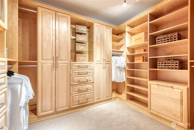 a work room with furniture and a wooden floor