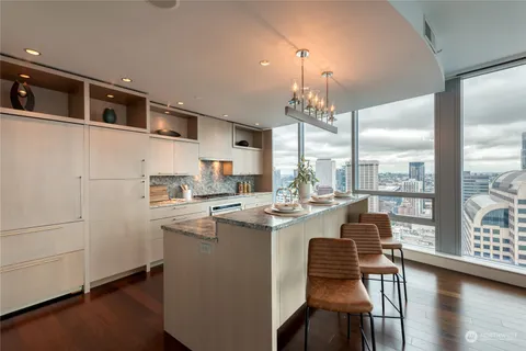 a dining room with table and chairs