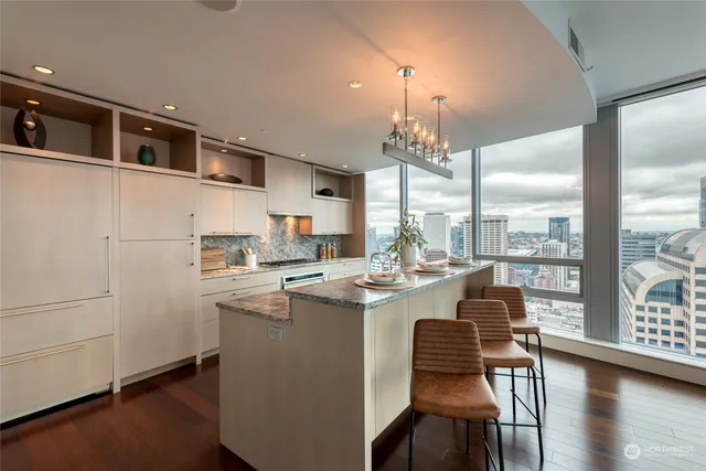 a dining room with table and chairs