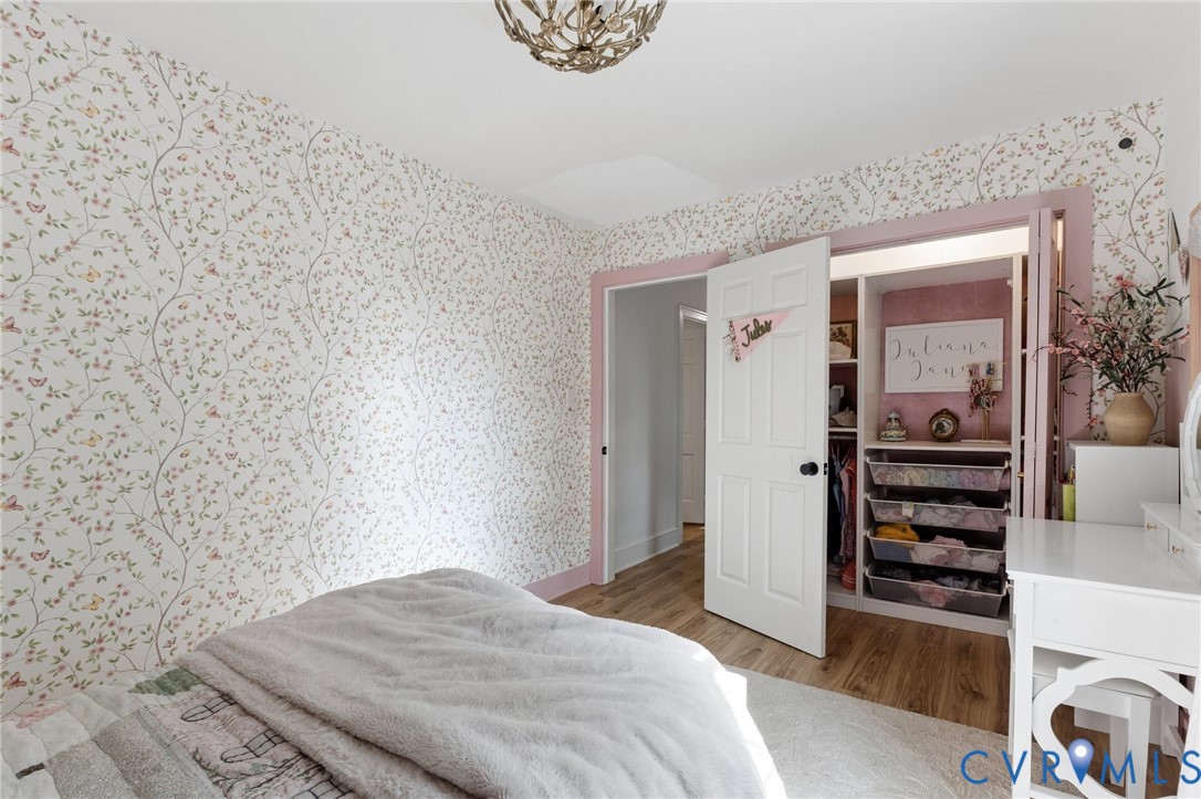 7200 Three Chopt Road Richmond, VA 23226 - Photo 36 of 48 Room featuring patterned wallpaper, wood-finish fl