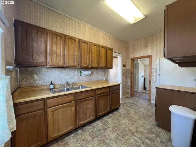 a bathroom with a sink and shower