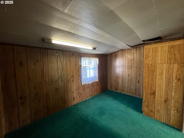 a view of a bedroom with a workspace