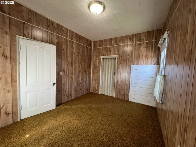 a view of a balcony with wooden floor and outdoor space