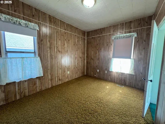 a view of a balcony with wooden floor