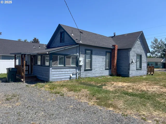 a house that has a big yard in front of it